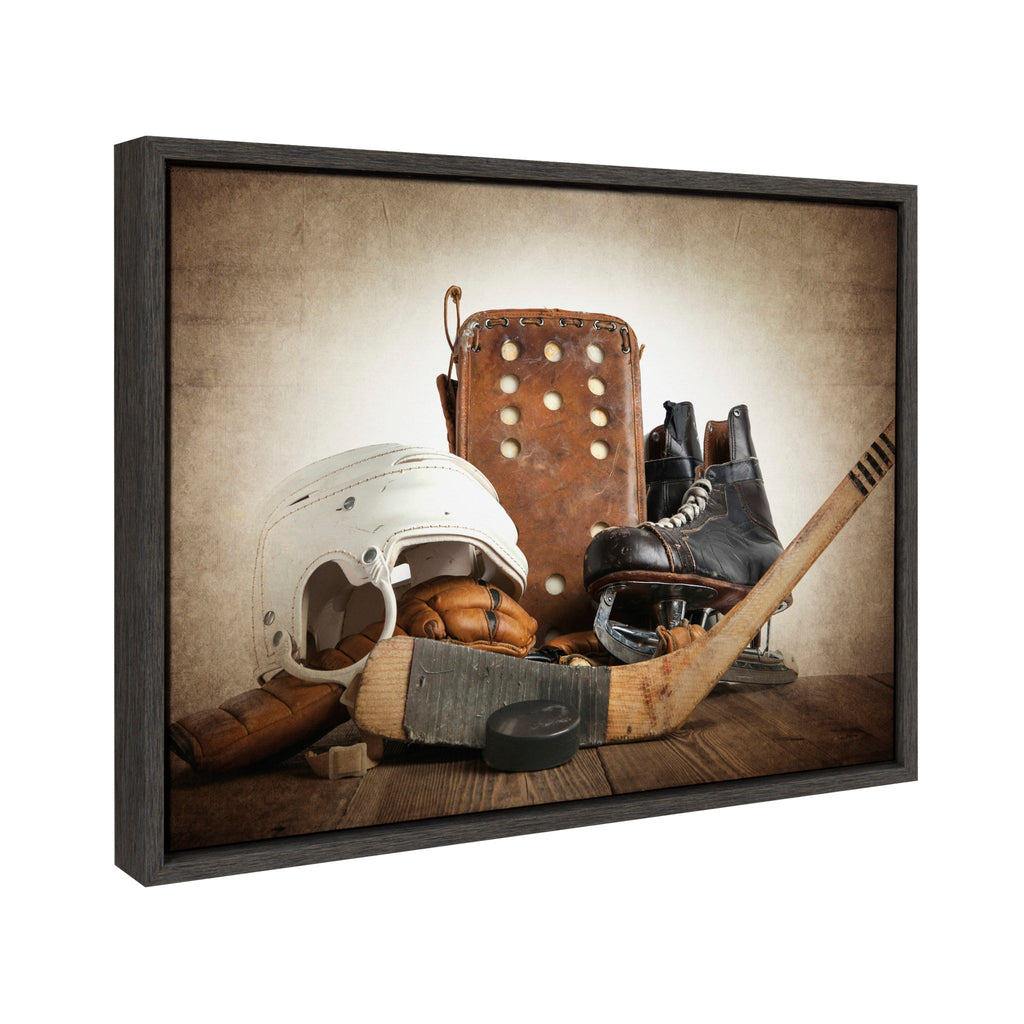 Sylvie Hockey Gear Framed Canvas by Shawn St. Peter