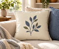 Gathered at Home Leafy 18 by 18 pillow styled on a neutral sofa